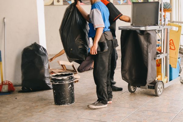 janitor-men-take-few-big-black-bags-trash-cleaning-building-area